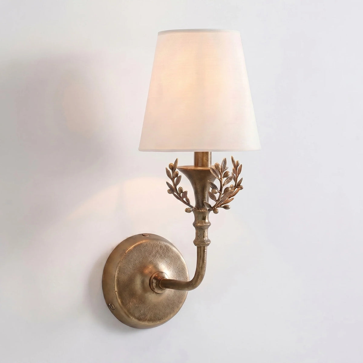 Antique brass Charles wall sconce with a linen shade